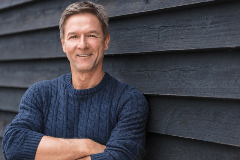 Smiling man feeling confident after taking a free online ADHD test for adults.