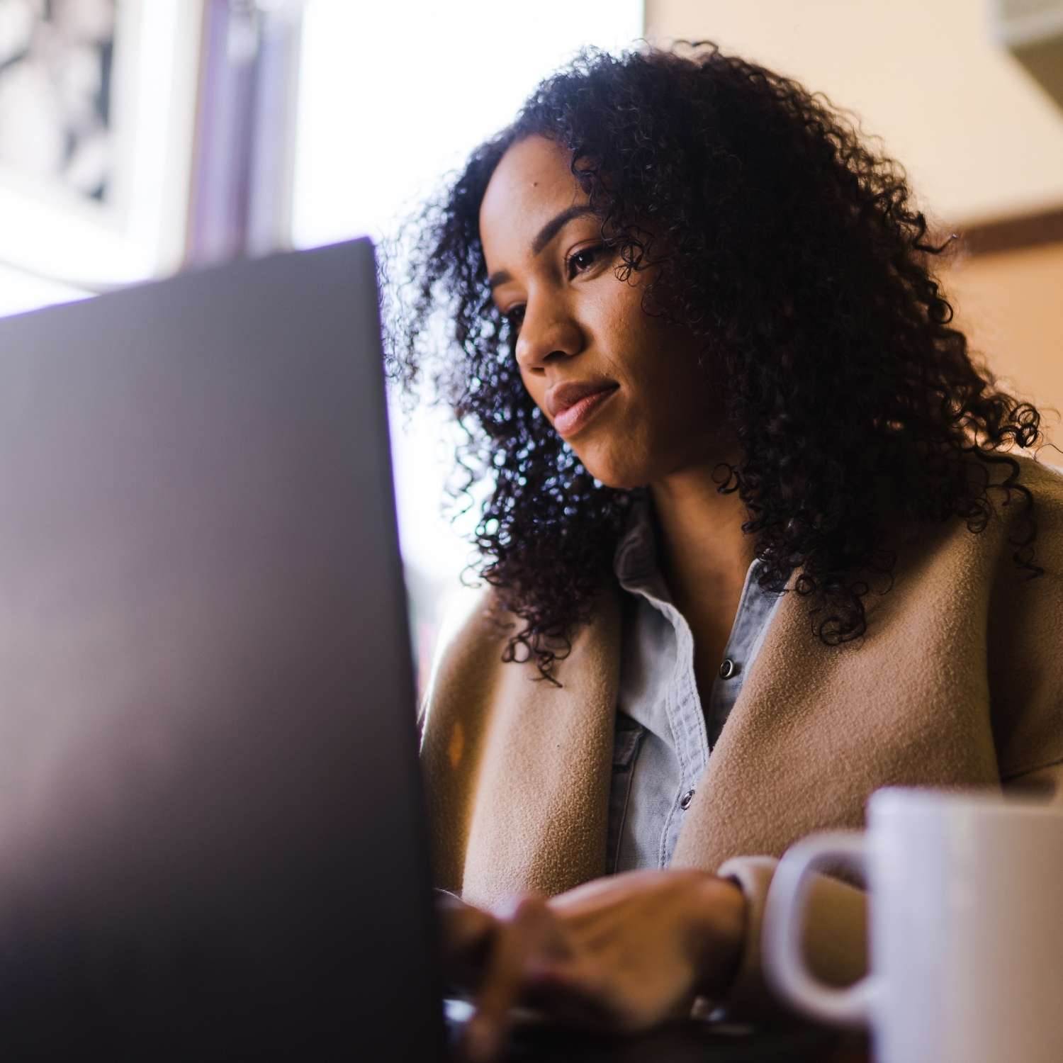 bar-evaluation-online-assessment-woman Woman using a laptop for a bar exam accommodations evaluation and documentation review